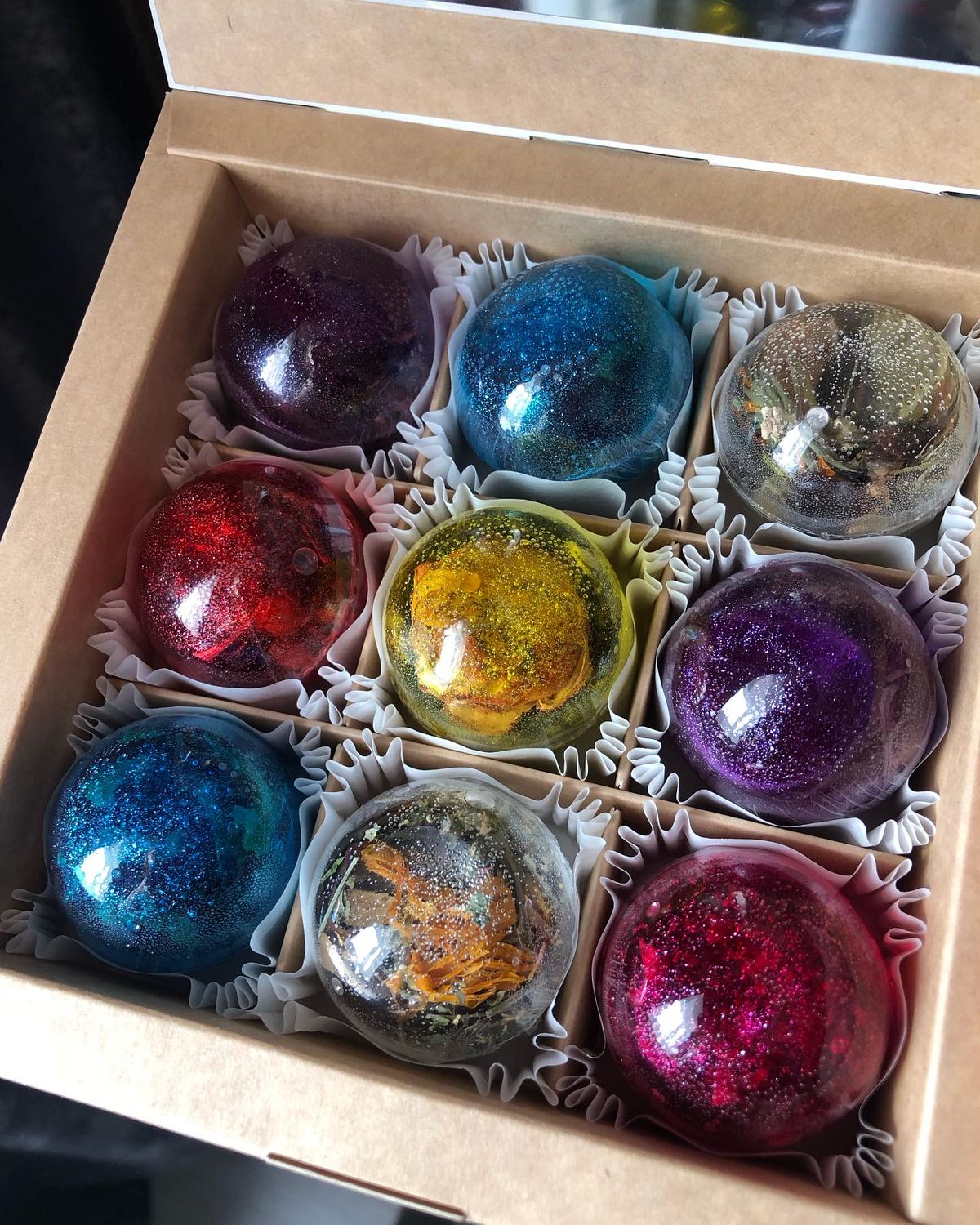 Nine galaxy-coloured tea bombs in presentation box